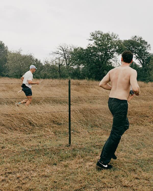 Crew cheering for their runner during a backyard ultra
