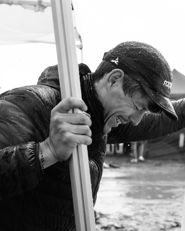 Crew managing gear in difficult conditions at a backyard ultra